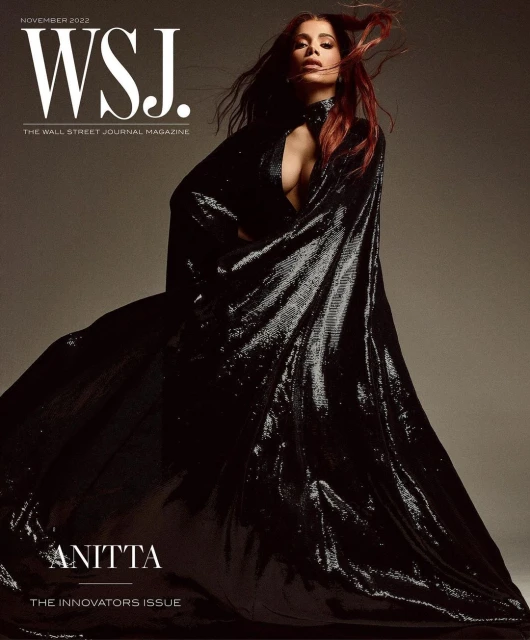 WSJ magazine cover featuring Anitta wearing a shimmering black gown, captured in a medium shot with soft lighting and a neutral background.