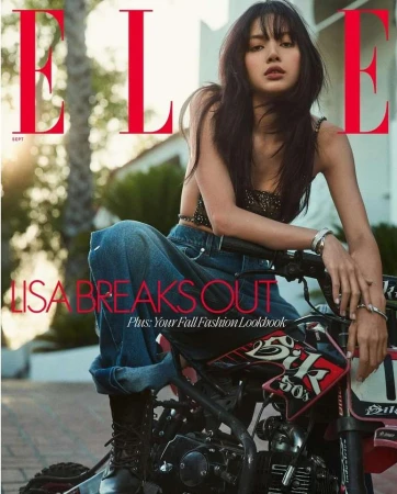 Lalisa Manobal posing on a motorcycle for an Elle magazine cover in New York by photographer Gregory Harris