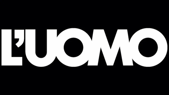Bold white typography spelling L UOMO set against a solid black background.