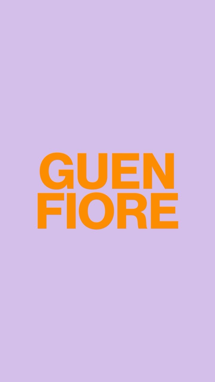 Bright orange sans-serif typography against a vibrant purple background with vertical orientation and centered text layout.