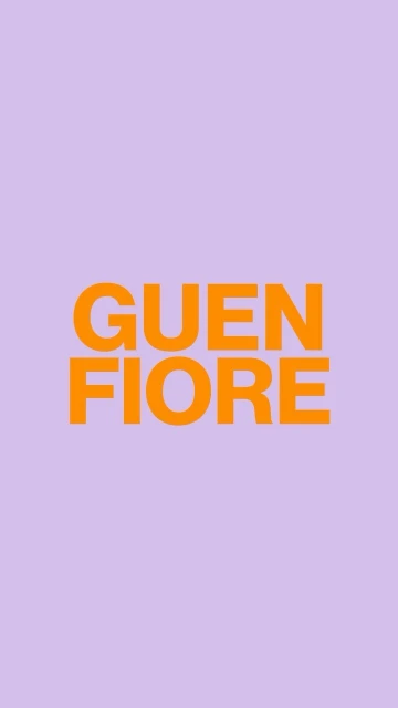Bright orange sans-serif typography against a vibrant purple background with vertical orientation and centered text layout.