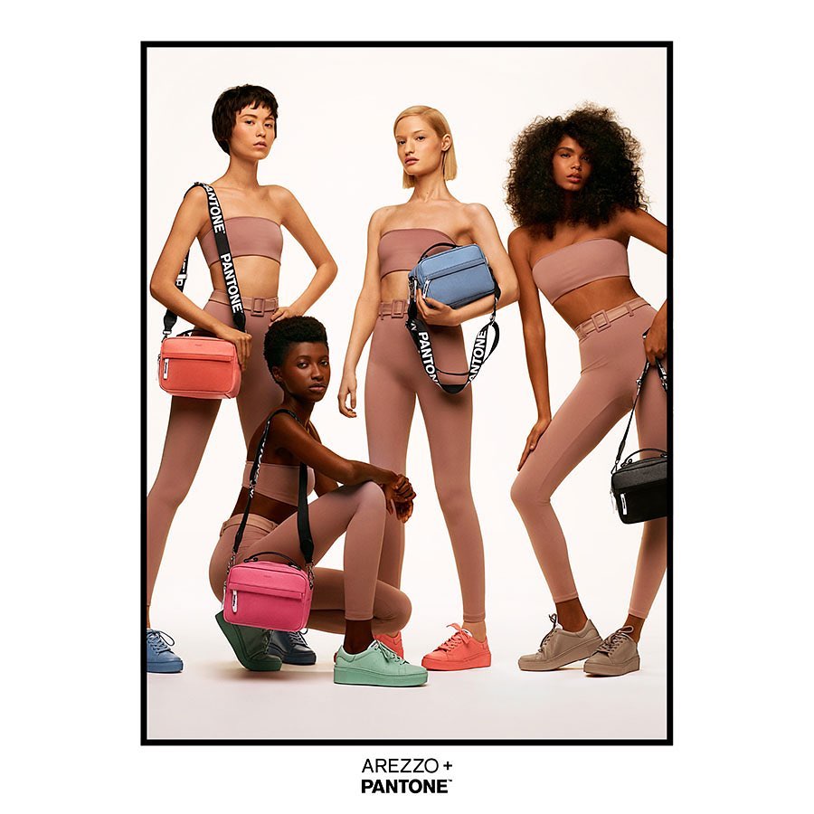 Four women model apparel and colorful handbags in a studio shot; the AREZZO + PANTONE logo is visible at the bottom of the frame.