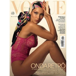 Bella Hadid wearing a pink lace top and patterned headscarf on a magazine cover photographed by Gui Paganini