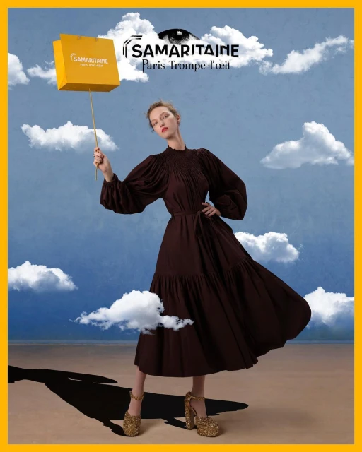A fashionable woman in a brown dress holds a yellow shopping bag against a dreamy sky backdrop with clouds, showcasing an artistic composition.