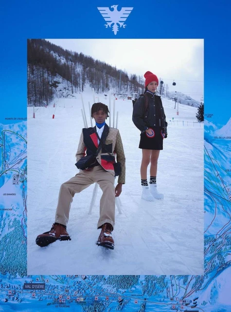 Two fashionable people in snow. Man sitting in designer blazer and woman standing in skirt with a red hat in a winter scene.