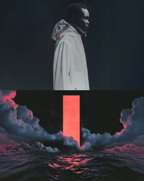 Dark-skinned male fashion model in a white jacket, contrasted with ocean waves and a red column under a night sky.