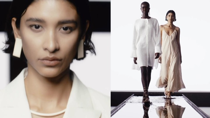 Two women in white and neutral dresses walk on a reflective runway in a fashion show. Close-up of one woman in a white jacket and earrings.
