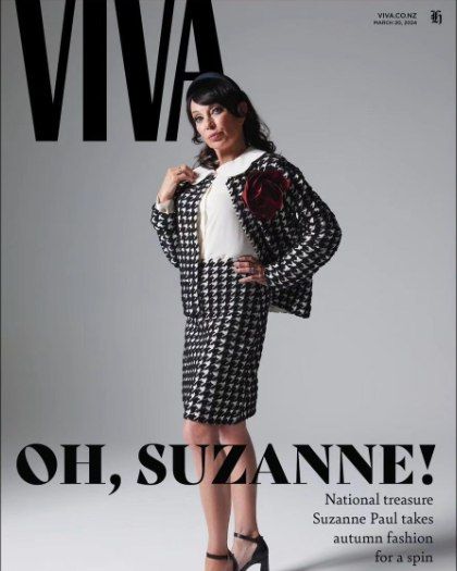 Magazine cover featuring a fashionable woman in a black and white houndstooth skirt suit, posing against a grey backdrop with bold title text.