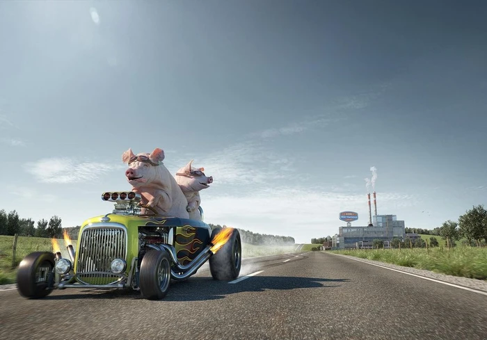 Two pigs wearing aviator goggles driving a custom hot rod car with flames along a sunny asphalt road with industrial buildings in the distance
