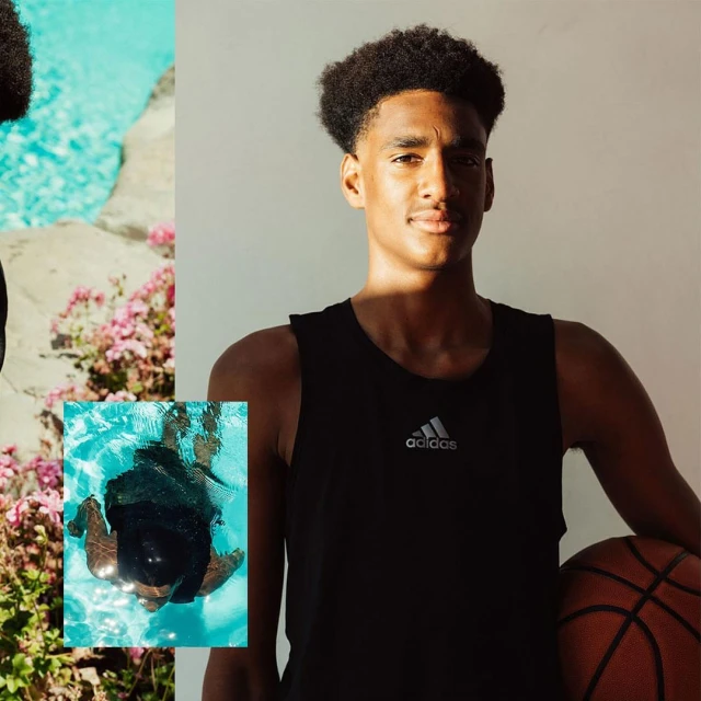 Portrait of a young adult male in a black tank top holding a basketball, with a pool and flowers in the background.
