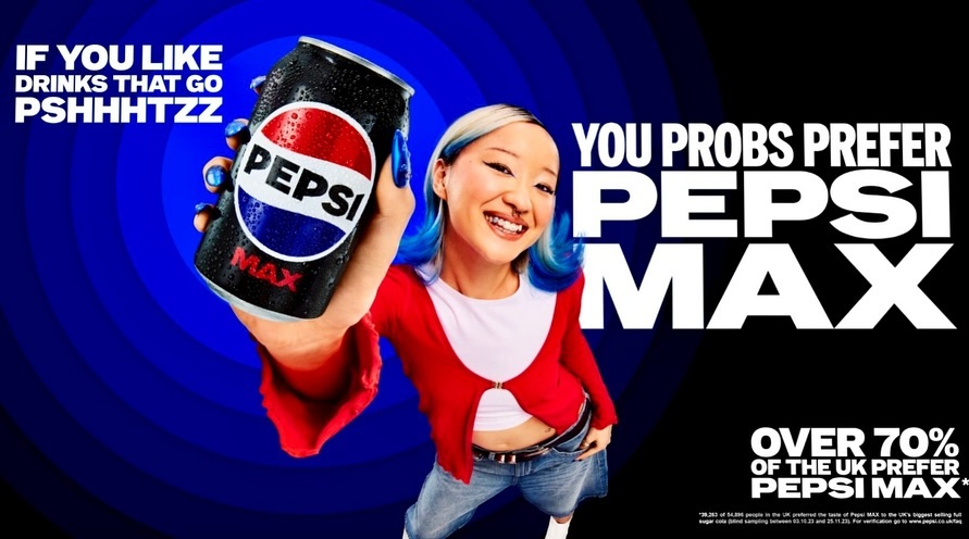 An Asian woman holds a Pepsi Max can with a blue and black backdrop, promoting the drink with a focus on branding and visual appeal.