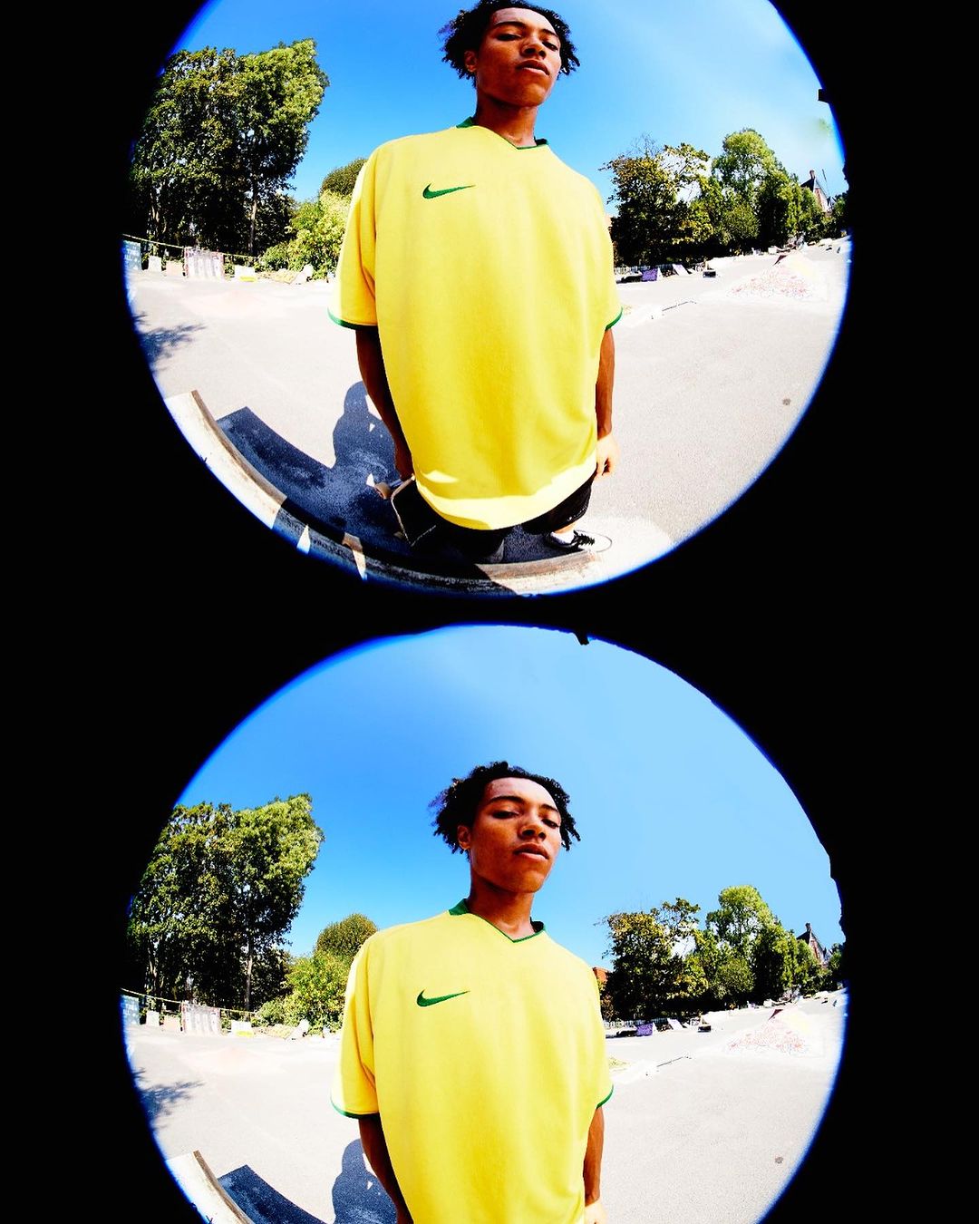 Eye-level fisheye shot of a young adult man wearing a yellow Nike soccer jersey, standing outside on a sunny day, duplicated in frame.