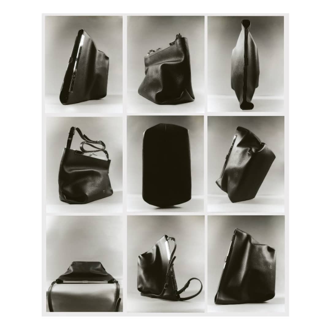 Monochrome product shot featuring a grid of black leather handbags in different shapes and orientations against a neutral background.