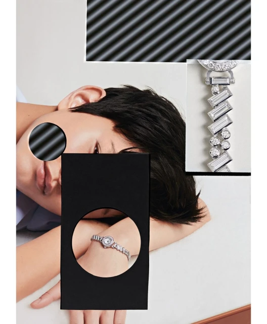 Woman wearing a diamond watch on her wrist, with an artistic, graphically-enhanced composition in a bright studio setting.