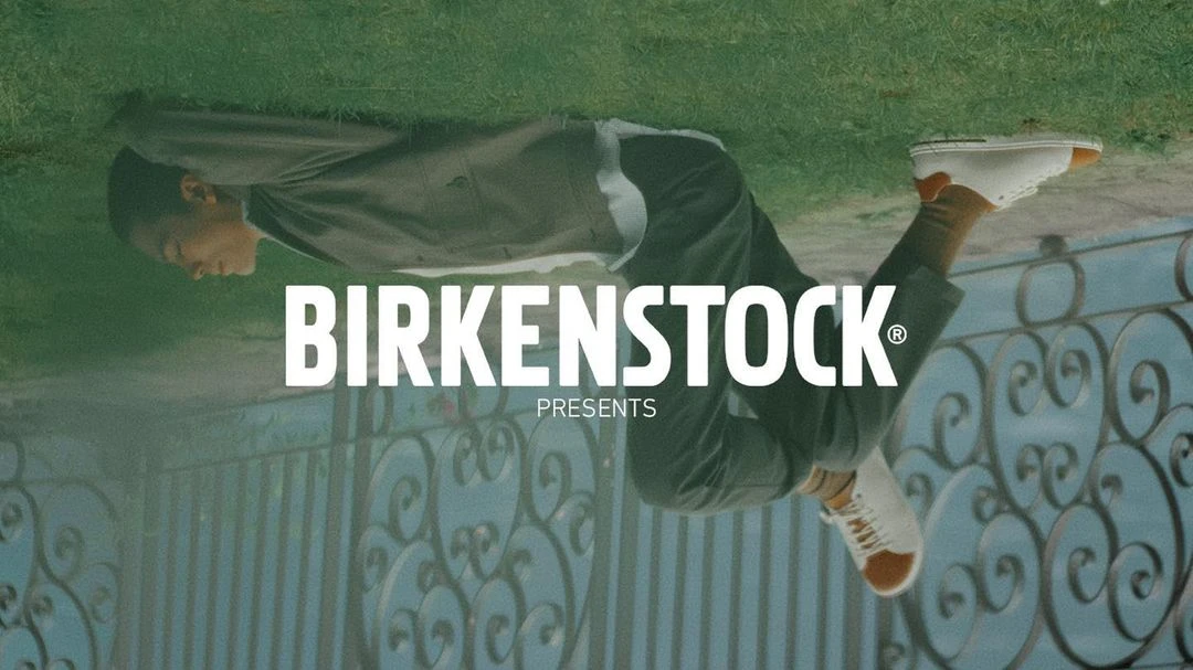 An upside-down shot features a person in casual clothing, tan socks, and white Birkenstock sneakers, next to the Birkenstock logo.