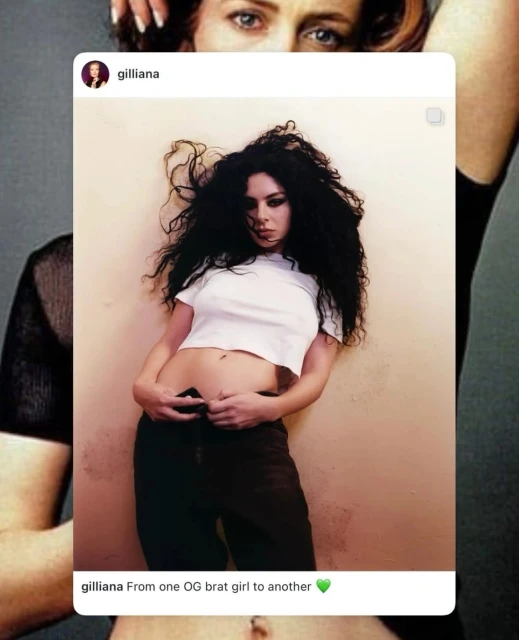 Portrait of woman wearing a white t-shirt and black pants, posing in an indoor environment. Woman has long black curly hair.