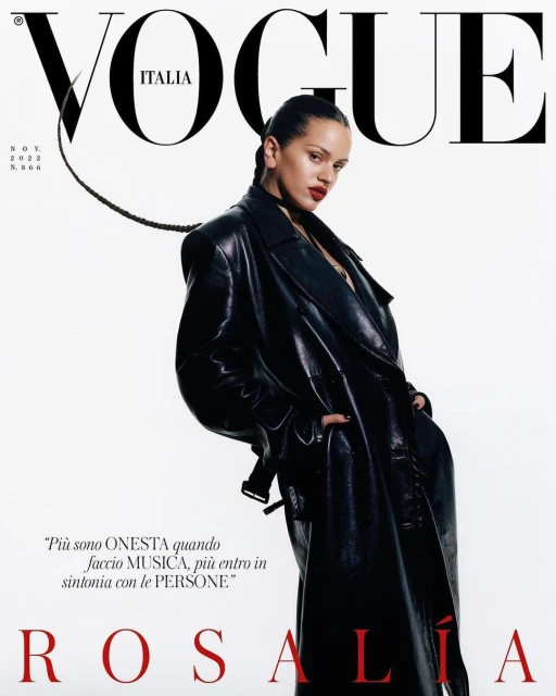 Vogue Italia magazine cover featuring Rosalía wearing a black leather trench coat and posing against a bright, neutral background.