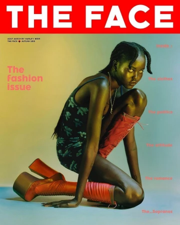 Model kneeling on a studio floor wearing a patterned dress and tall platform boots, photographed by Harley Weir.