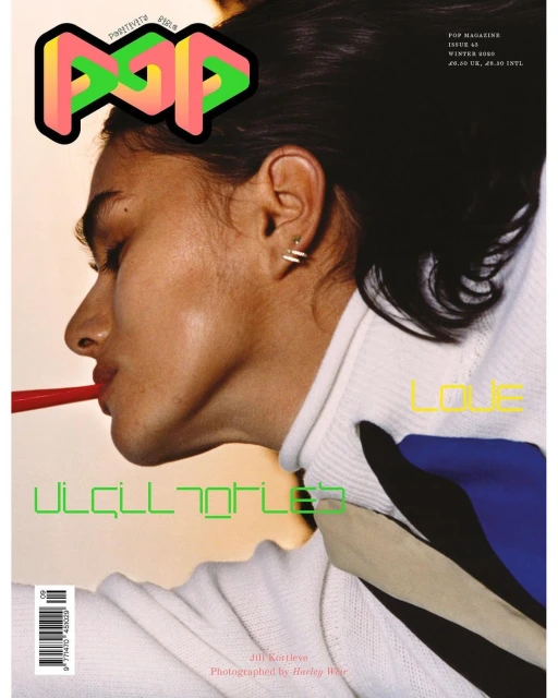 Magazine cover featuring woman in profile with graphic elements and text overlays, showcasing fashion and editorial design.