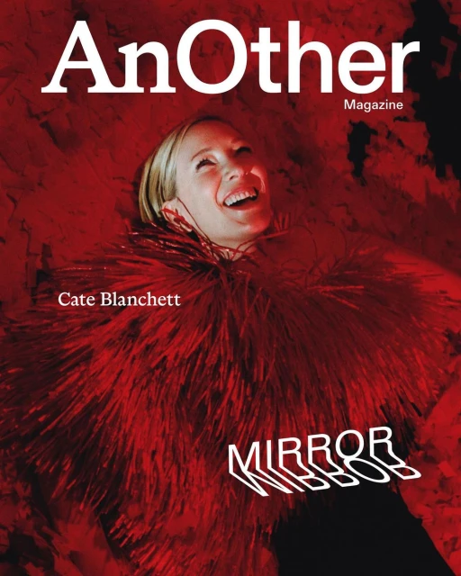 Magazine cover featuring Cate Blanchett wearing red feather boa, smiling, against a red and black background with magazine text.