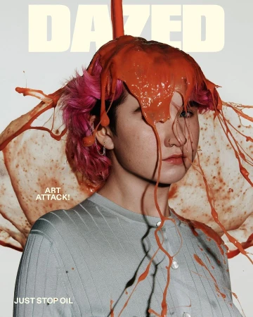 Dazed Magazine cover featuring person with bright pink hair and orange paint covering their head and shoulders on a white background.