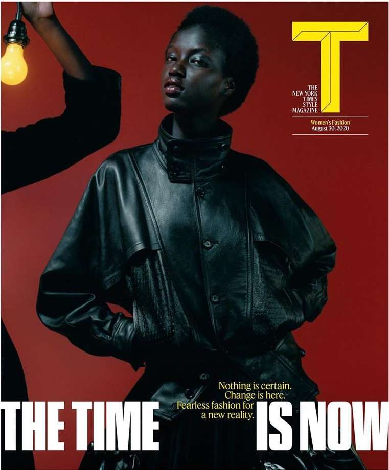 Magazine cover featuring a dark-skinned adult female model wearing a black leather jacket and an arm holding a lit lightbulb.