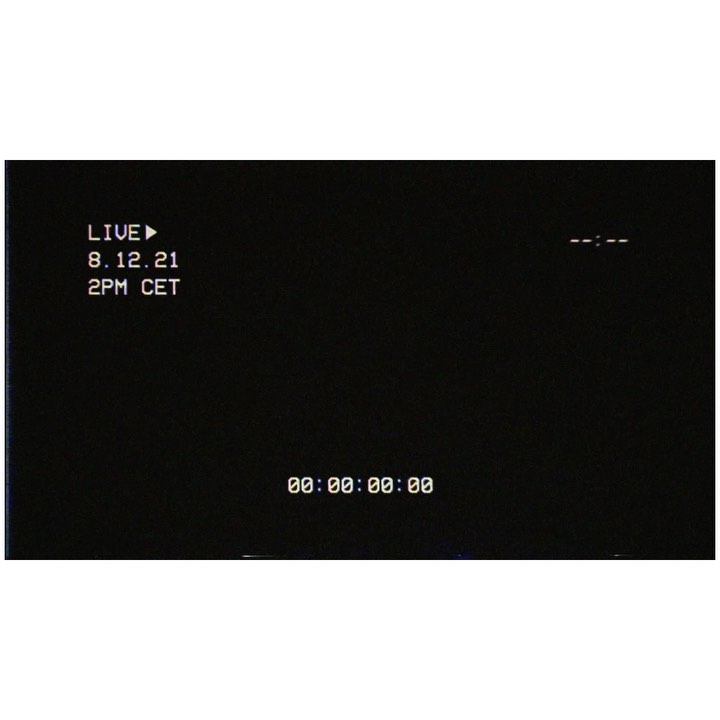 A dark screen displays retro-style text showing 'LIVE,' a date of '8.12.21,' time '2PM CET,' and a running timer of '00:00:00:00.'
