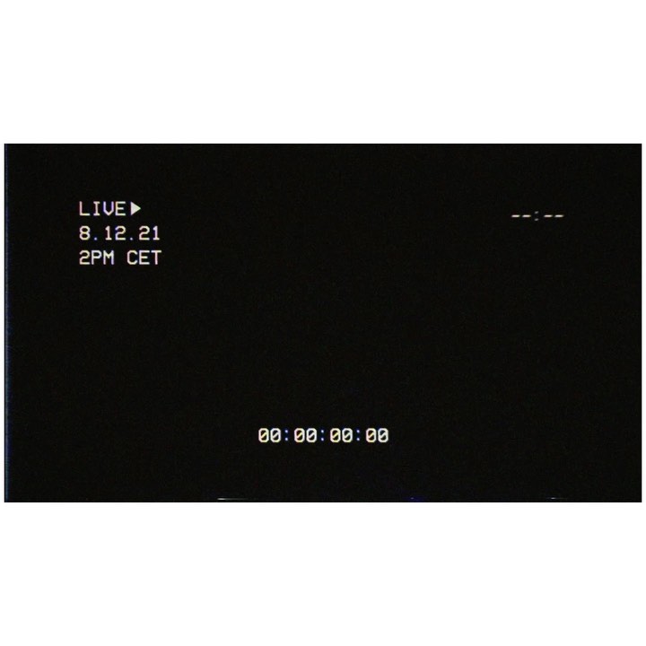 Dark screen with white text displaying timecode, the word "Live," a date, and a time, resembling a video recording interface.