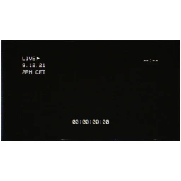 Black video overlay frame featuring retro white monospace on-screen display text showing a live date and time code.