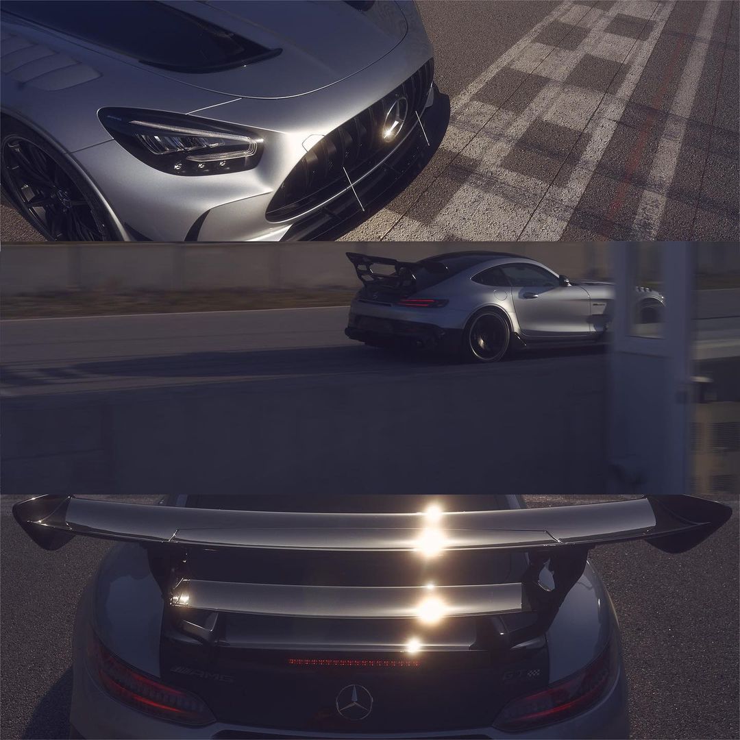 Silver Mercedes-AMG GT Black Series car on a racetrack, showcasing its sleek design, aerodynamic features, and high-performance capabilities.