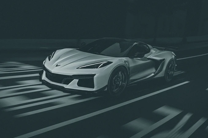 Sleek white sports car on a dimly lit road with prominent white stripes, showcasing a blend of modern design and high performance.