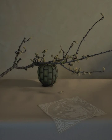 Still life photograph of a green vase with budding branches on a table, accompanied by a white embroidered cloth. Indoor setting.