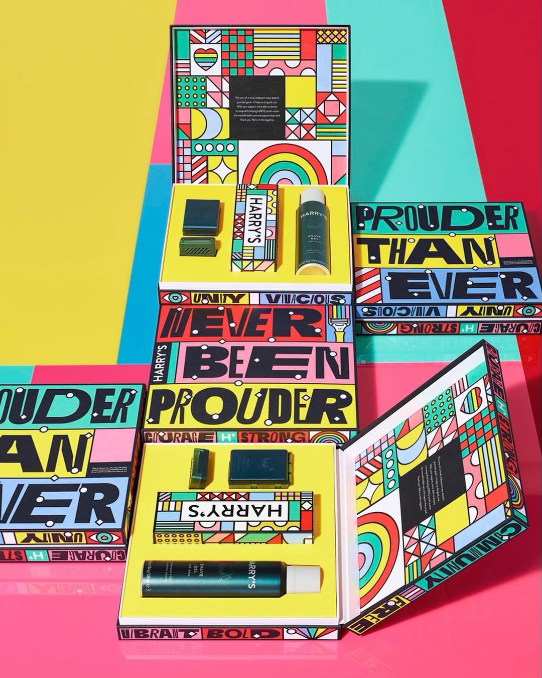 Colorful Harry's brand product boxes stacked in a studio setting featuring LGBTQ+ pride-themed designs, product shots, and vibrant colors.