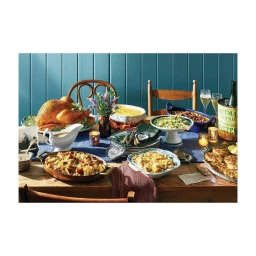Feast spread with roast turkey, various side dishes, wine glasses, and a wine bucket on a wooden table in New York.