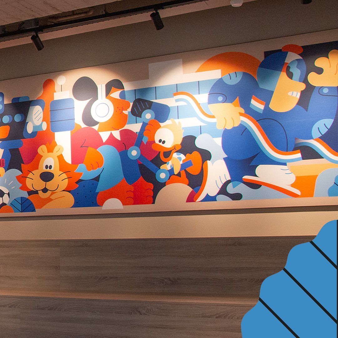 Whimsical wall art featuring cartoon animals and figures in bright colors. The mural includes a lion, a duck-like character, and abstract figures.
