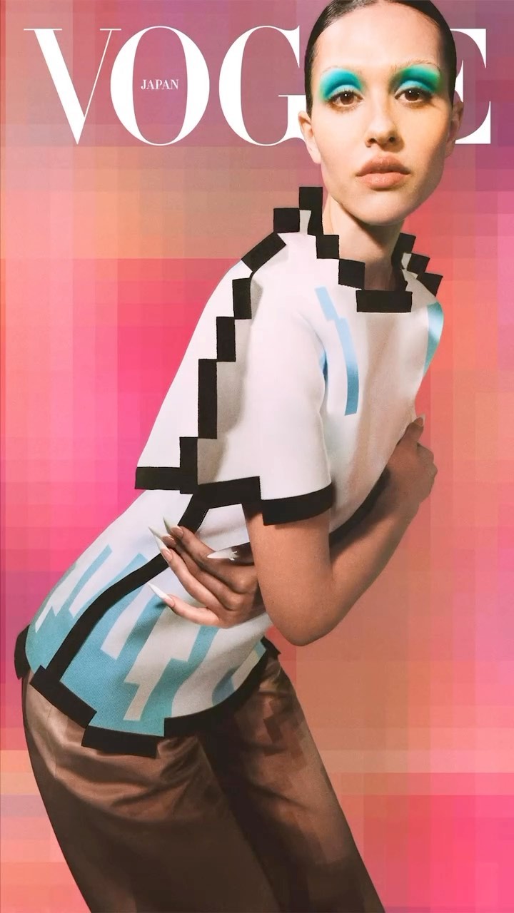 Vogue Japan cover featuring a woman with bold turquoise eyeshadow, wearing a white top with black pixelated trim, and gold pants.