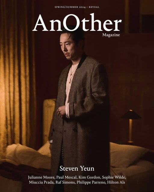 Magazine cover featuring Steven Yeun in a herringbone coat, photographed indoors with soft lighting and subdued tones, promoting Spring/Summer 2024.