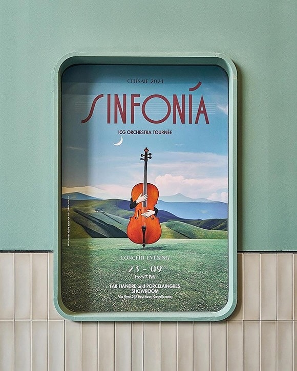 Orchestra tour poster on a wall advertises Sinfonía’s Cersaie 2021 concert evening on the 23rd of September with cello illustration.