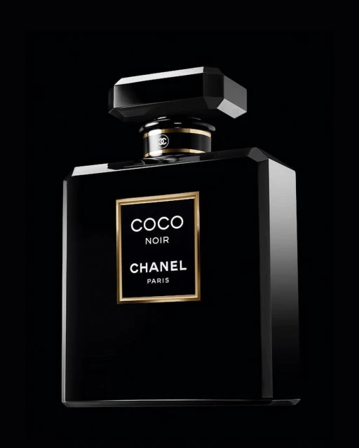 Chanel Coco Noir perfume bottle on a dark background with gold accents and elegant branding; product photography for beauty and fragrance.