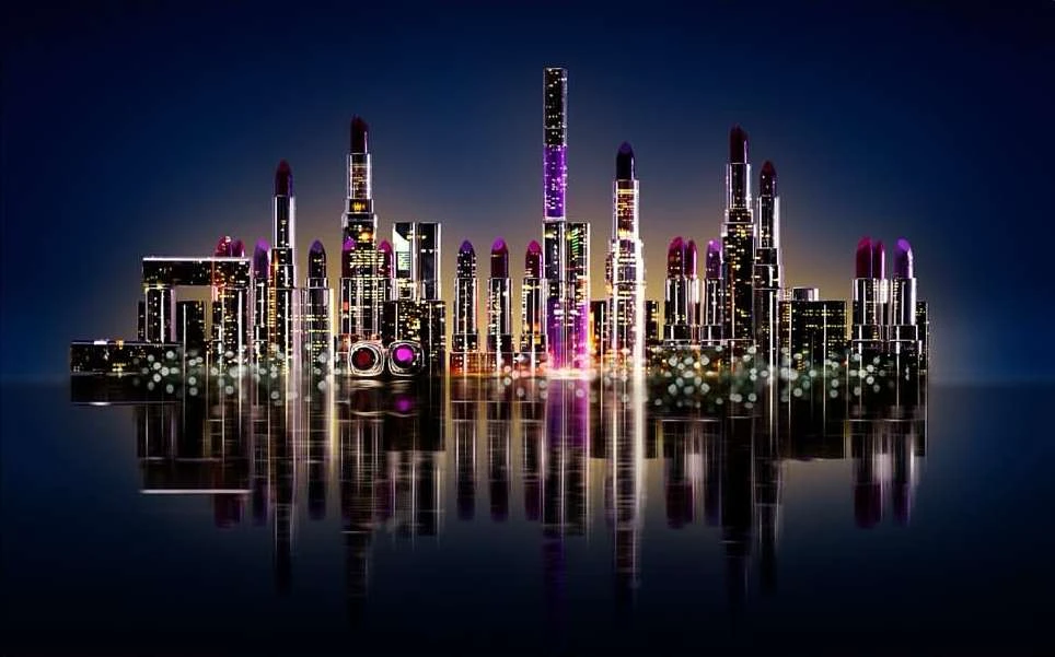 Beauty product concept: Lipstick tubes create a cityscape silhouette against a dark blue background, with reflections on a surface.