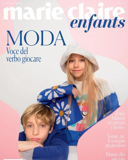 Marie Claire Enfants magazine cover featuring two children wearing knitwear and the title text in pink and blue with a white background.