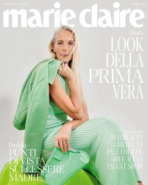 Magazine cover featuring an adult woman with long blonde hair, wearing a green striped outfit and holding a glossy green handbag.