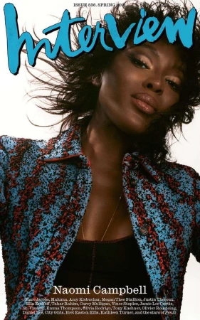 Magazine cover featuring Naomi Campbell wearing patterned blue and red jacket, black top, with Interview magazine logo in blue text.