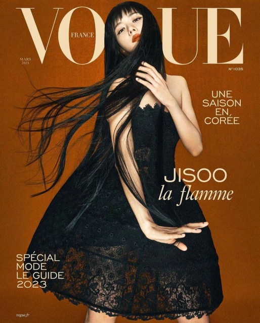 Vogue France cover featuring Jisoo in a black lace dress against a brown background with magazine text and the 'la flamme' subtitle.