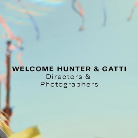 Welcome message with confetti: "WELCOME HUNTER & GATTI Directors & Photographers" against a bright sky-blue background.