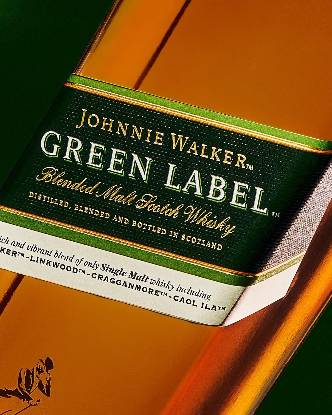 Close-up of Johnnie Walker Green Label bottle showcasing its green label, golden liquor, and whisky brand details.