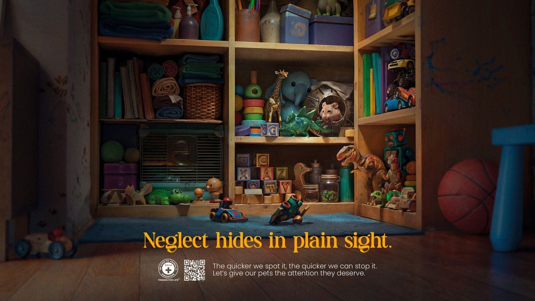 Hamster peeks from a shelf overflowing with toys, books, and games, casting a spotlight on pet neglect awareness.