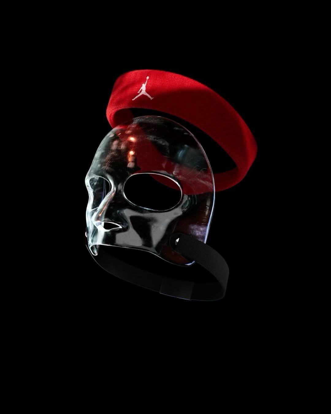 Clear mask with a red headband featuring a white logo on a black background, creating a dramatic, high-contrast composition.