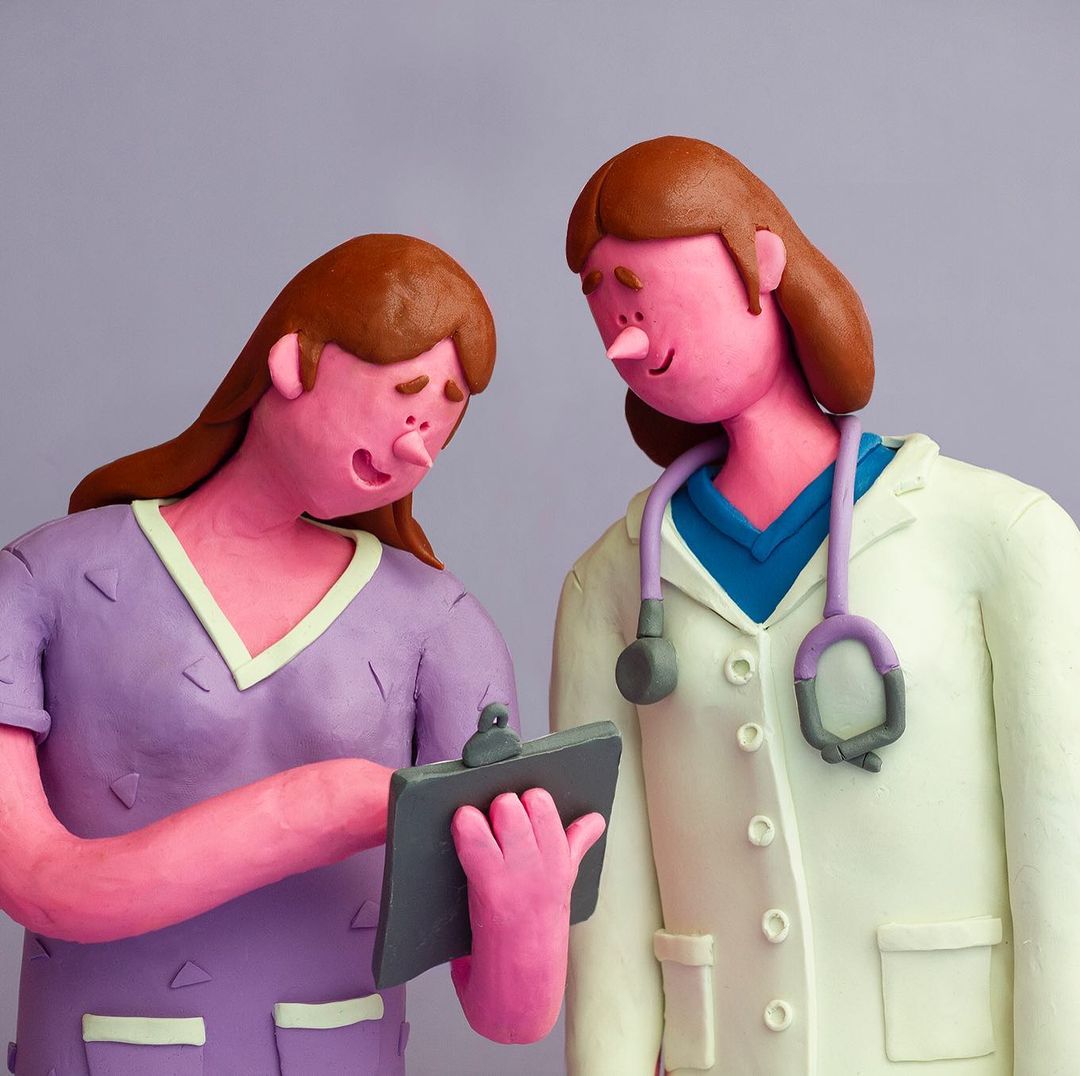 Claymation image showing two figures, one in lavender scrubs writing on a clipboard and one in a lab coat with a stethoscope.