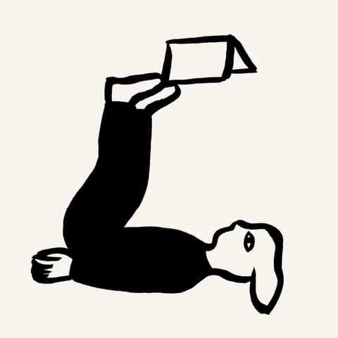 Illustration of a person lying on their back with their legs up, holding a white box above them, minimalist black and white drawing.